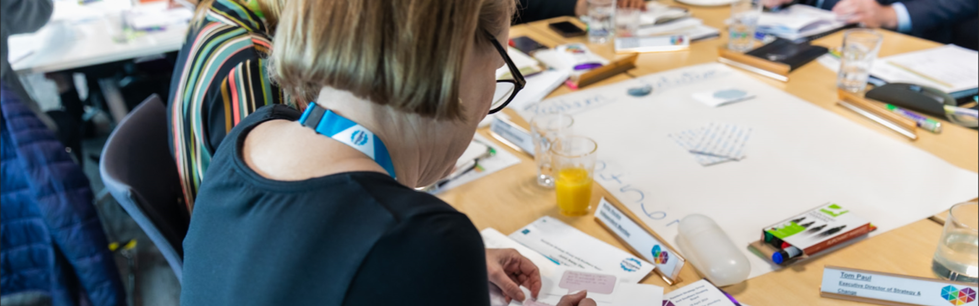 Involved resident writes on a piece of paper