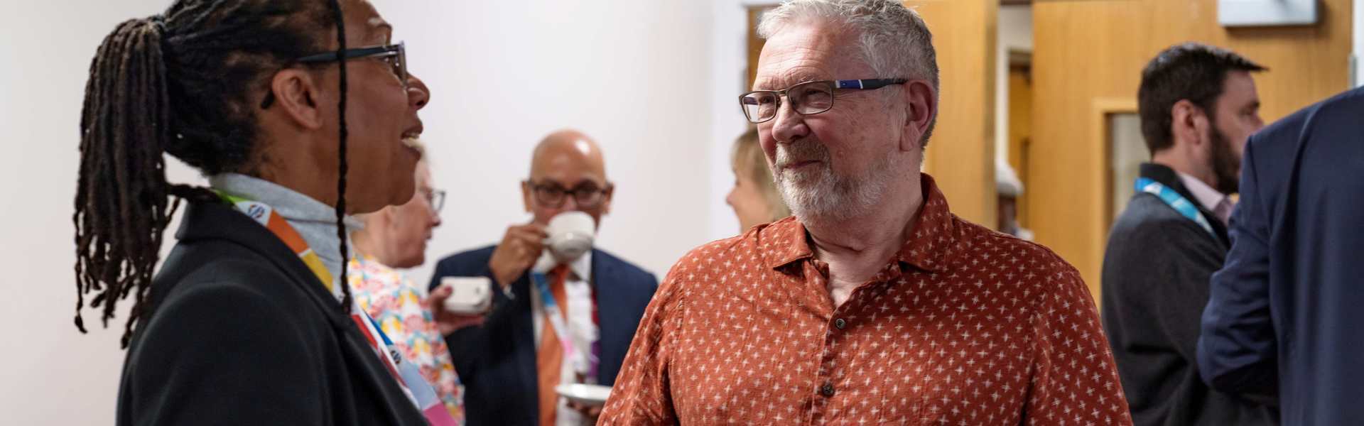 Dave Burton, Chair of the Scrutiny Panel, speaks to Geanna Bray, Board Member Responsible for Complaints