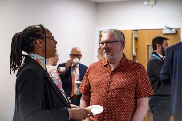 Dave Burton, Chair of the Scrutiny Panel, speaks to Geanna Bray, Board Member Responsible for Complaints