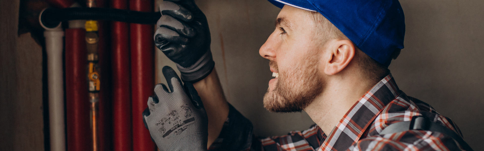 Service Man Adjusting House Heating System